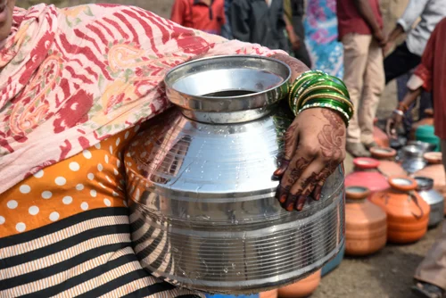 Woman with jug of water
