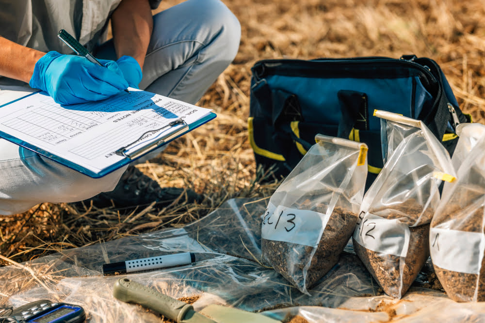 researcher taking samples of containments found in ground water