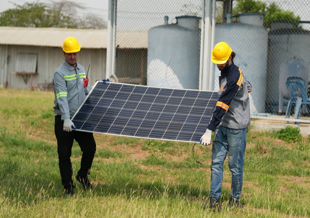 technicians installing solar power panels